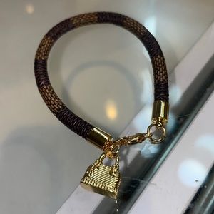 Brand New brown leather bracelet with gold bag